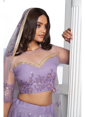 Trendy Lilac net Lehenga with sequin thread embroidery comes designer blouse.